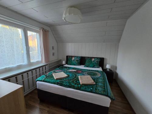 a bedroom with a bed in a small room at Ferienwohnung Helena in Markkleeberg