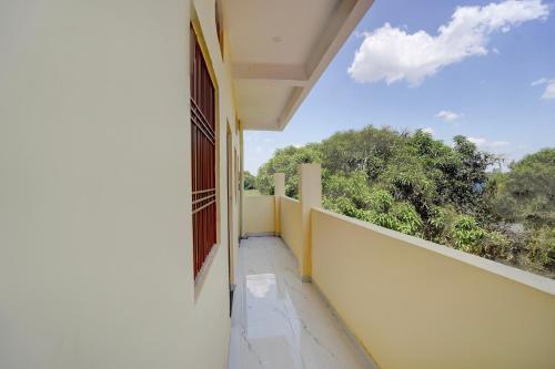 an empty balcony with a view of trees at SPOT ON Galaxy Hotel in Lucknow