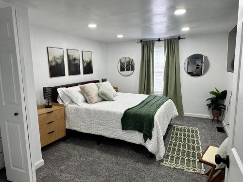 a bedroom with a large bed and a window at Arminta Street Retreat in DuBois