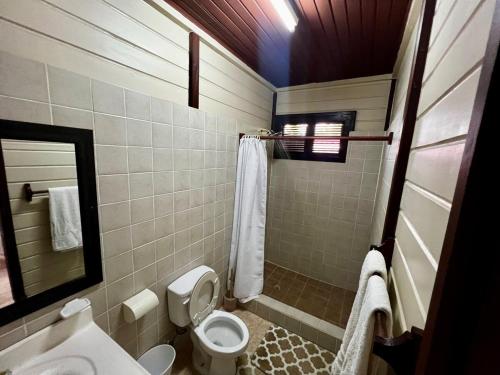 a bathroom with a toilet and a sink at Annes Retreat in Castries