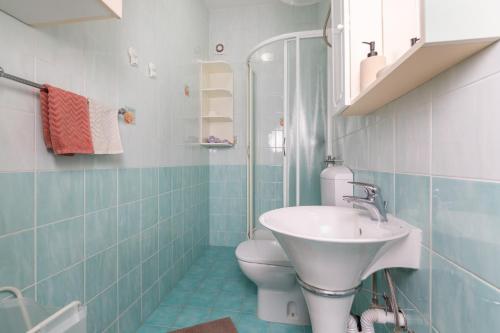 a bathroom with a sink and a toilet at Blue Horizon Studio Opatija in Opatija