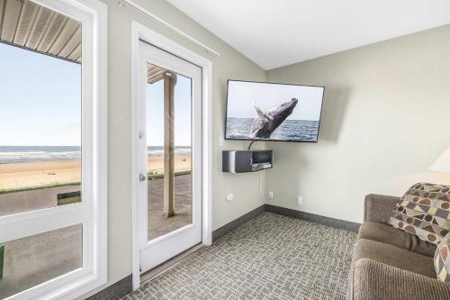 a living room with a view of the ocean at Ocean view studio no stairs-Full Kitchen Patio in Lincoln City
