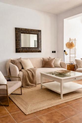 a living room with a couch and a table at Villa Oasys in Almería