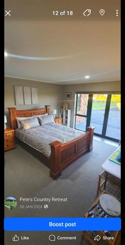 a bedroom with a large bed in a room at Peter Country Retreat in Midhirst