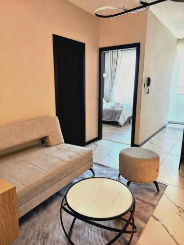 a living room with a couch and a table at Golden in Cochabamba