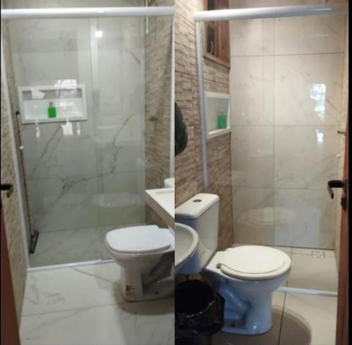 a bathroom with a toilet and a shower at Estância 7 praias in São Paulo