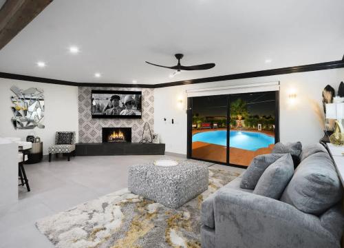 a living room with a couch and a tv at Modern Roose-Private Pool-In Old Town Scottsdale in Scottsdale