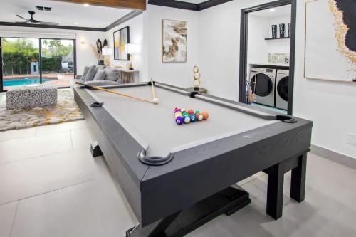 a pool table in a living room at Modern Roose-Private Pool-In Old Town Scottsdale in Scottsdale