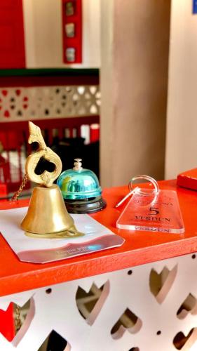 a bell on top of a counter with tags at Hotel La Casona in Jardin