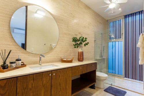 a bathroom with a sink and a mirror at Casa del Paseo Luxury Home in Centro Rooftop Bar & 2 Pools in Mérida