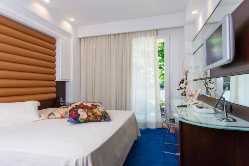 Hotel Luna Riccione e Aqua Spa Only Adults +12にあるベッド