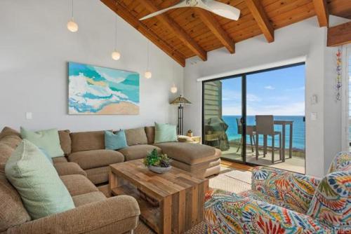 a living room with a couch and a table at Solana Beach Resort in Solana Beach