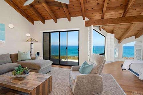 a living room with a couch and a table at Solana Beach Resort in Solana Beach