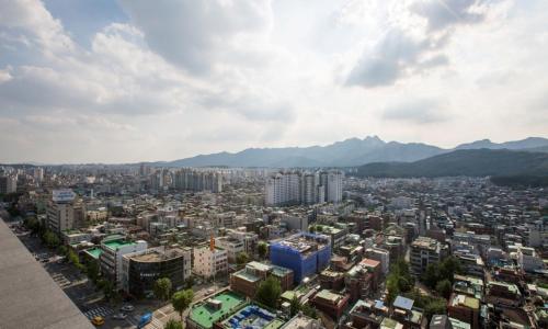 a view of a city with mountains in the background at Dobong Hotel Bay204 in Seoul