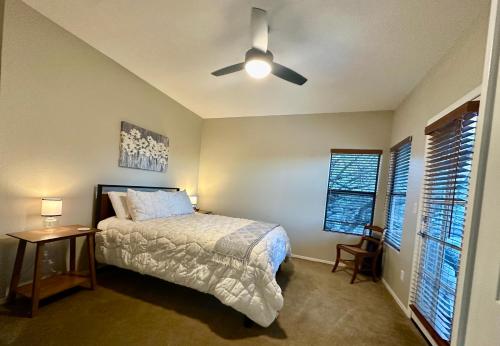 a bedroom with a bed and a ceiling fan at Our Mountain View in Tucson