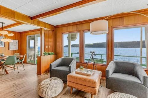 a living room with a view of the water at Oyster Oasis in Tahuya