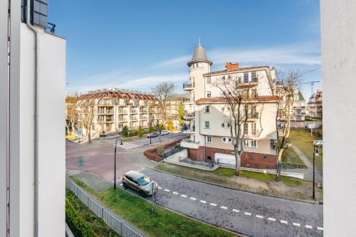 a view from a window of a street with buildings at Casa Marina, Sun & Snow in Świnoujście