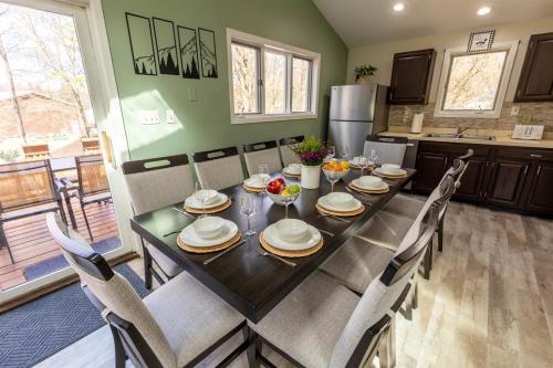 a dining room with a table and chairs in a kitchen at Pickleball Pool Table Hot Tub FirePit King Bed in Blakeslee