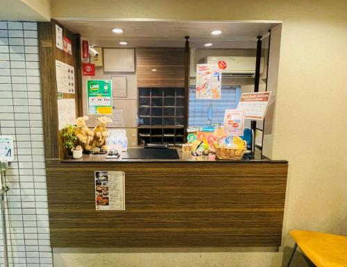 a kitchen with a counter with a counter top at Wallaby House in Kawaguchi