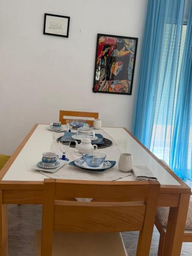 a table with plates and dishes on top of it at Lac 2 Tunisi in El Aouina Station