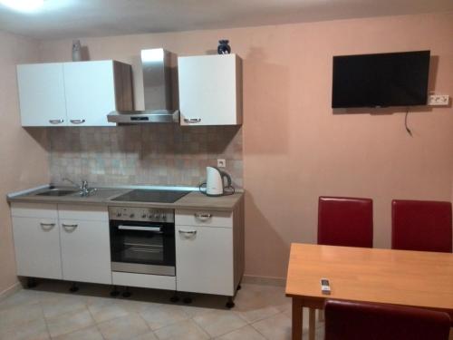 Kuchyň nebo kuchyňský kout v ubytování Apartments Bogdanovic
