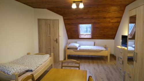 Postel nebo postele na pokoji v ubytování Podřipská Farma