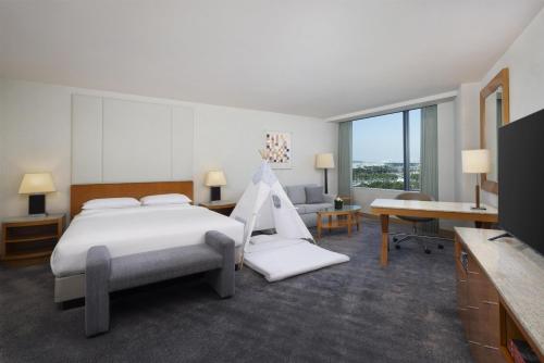 a hotel room with a bed and a desk at Grand Hyatt Incheon in Incheon