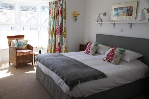 Postel nebo postele na pokoji v ubytování Cnapan Guest House