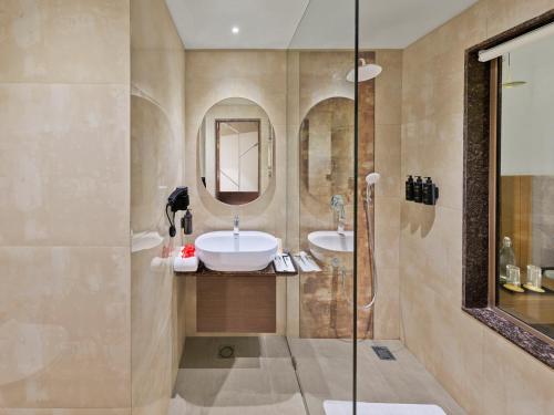 a bathroom with a sink and a mirror at Empire By Zuper in Bhopal