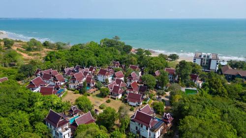 an aerial view of a group of houses on a hill near the ocean at Private Pool 4BR Villa with Sea View Sleeps 8 in Mae Pim