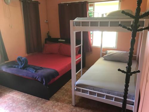 a couple of bunk beds in a room at Kama Siri Koh Kood in Ko Kood
