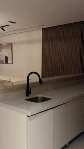 a kitchen with a sink and a counter top at منتجع شاطئ الدانة Hus Chalet in Dammam