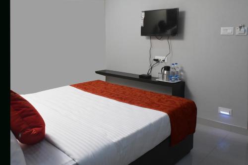 Ένα ή περισσότερα κρεβάτια σε δωμάτιο στο Hotel S L E Residency