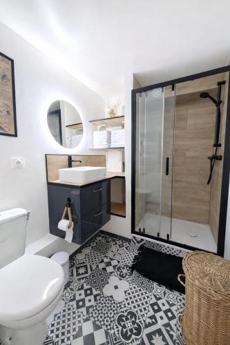 a bathroom with a toilet and a sink and a shower at Le chalet Mountain-style duplex 6 people in Meulan