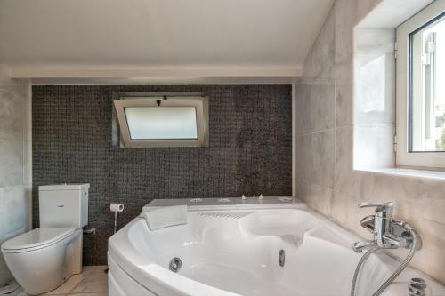 A bathroom at Legrena Beach Villa