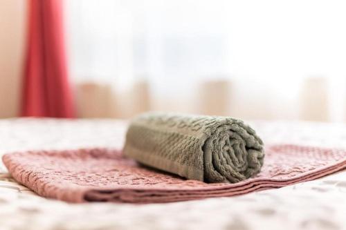 a ball of yarn sitting on top of a bed at Rooms Jagoda I Cozy Alpine Stay Near Bled in Blejska Dobrava