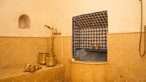 a bathroom with a shower and a sink at Dar Eddihi Essaouira in Essaouira