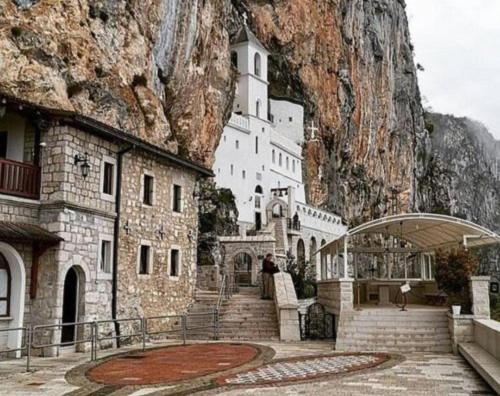 a building on the side of a mountain at Apartman DAR Bošković Studio in Zagorak