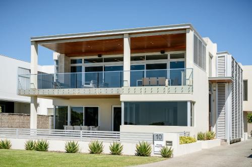 a large white house with a balcony at Number 10 I Private Properties in Dunsborough