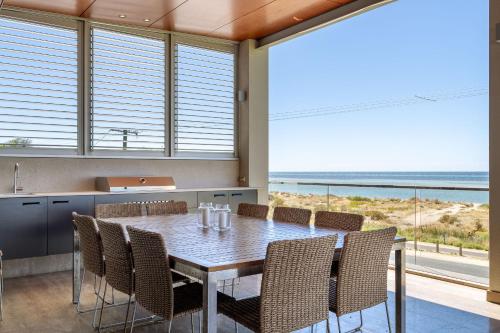 a kitchen and dining room with a table and chairs at Number 10 I Private Properties in Dunsborough