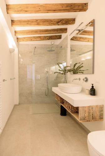 a bathroom with a sink and a mirror at Casa Sol in Denia
