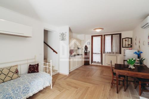 a bedroom with a bed and a desk and a table at Gold Palace ***** in Ferrara