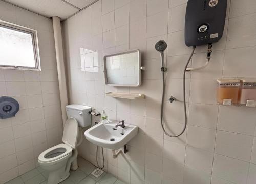 a bathroom with a shower and a toilet and a sink at Above A Shoplot No Noise Worries 12Pax & FreeWiFi in Ipoh
