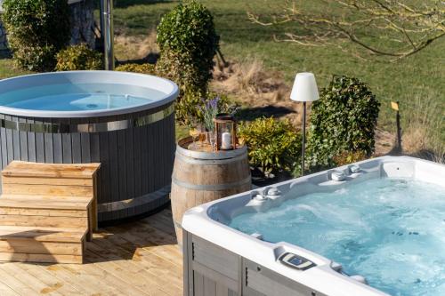 a jacuzzi tub sitting in a yard at Villa Brunnby in Mölle