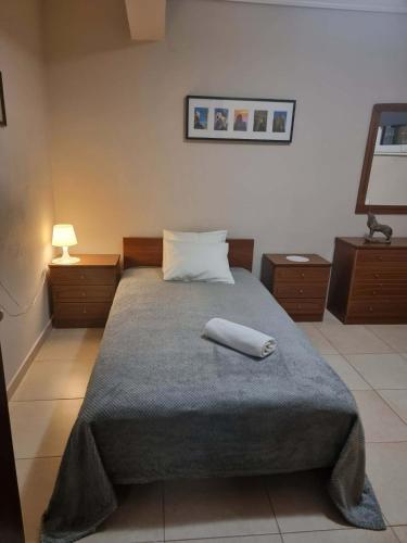 a bedroom with a bed with a white towel on it at Rodi Home in Sotíra