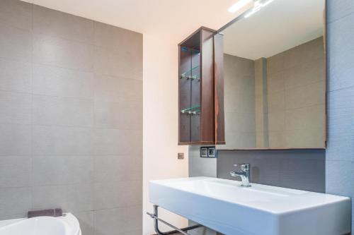 a bathroom with a white sink and a mirror at Son Vigili in Campos
