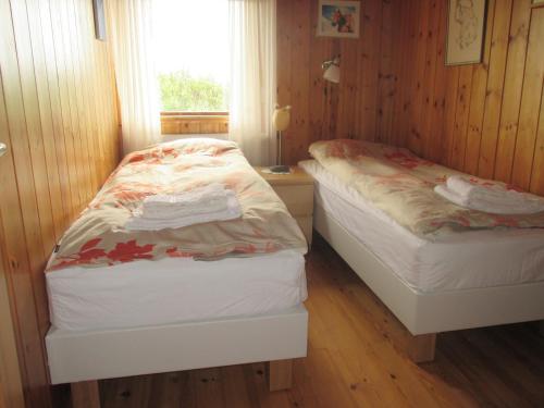Postel nebo postele na pokoji v ubytování Grímsstaðir Guesthouse