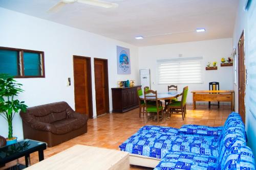 a living room with a couch and a table at Guesthouse Chez Marco in Cotonou