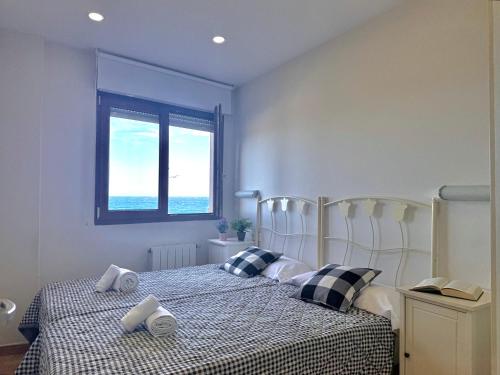 a bedroom with two beds and a window at La Caseta - 5907 in Isla
