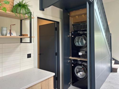 a laundry room with two washer and dryer at Cottage 505 - Roundstone in Roundstone